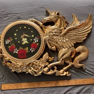 Tacky gold unicorn quartz clock. Keeps time. Roses and a butterfly accent.